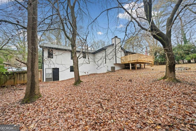 rear view of house with a wooden deck