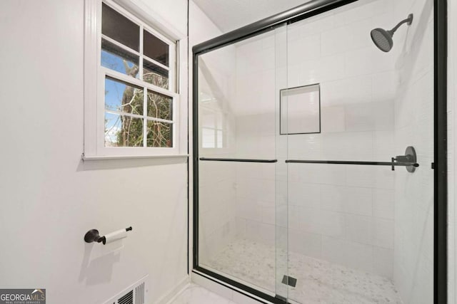 bathroom featuring walk in shower