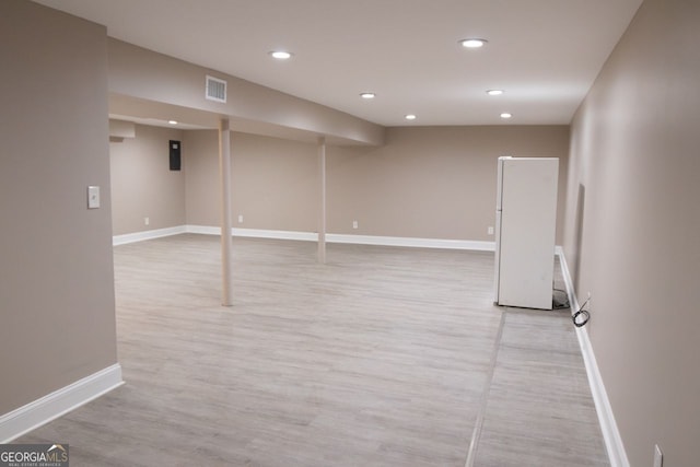 basement with light wood-type flooring