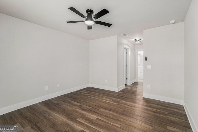 unfurnished room with dark hardwood / wood-style floors and ceiling fan