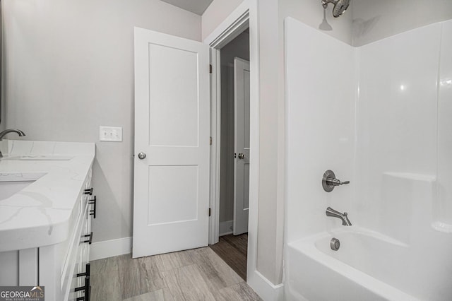 bathroom with vanity and shower / bath combination