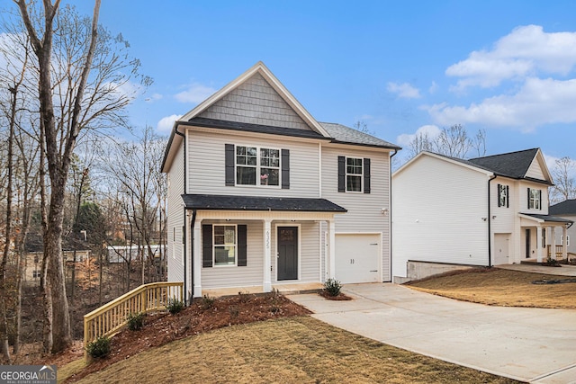 view of property with a front lawn, a porch, and a garage