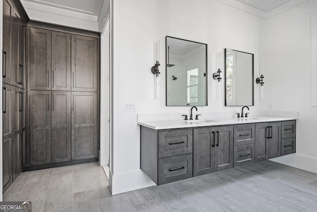 bathroom featuring crown molding and vanity