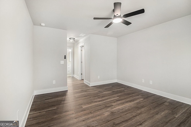 unfurnished room with ceiling fan and dark hardwood / wood-style flooring