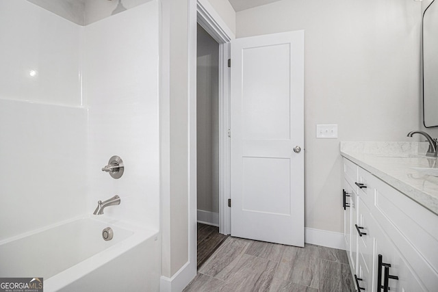 bathroom with vanity and shower / bathtub combination