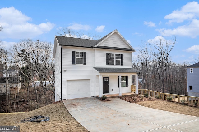 view of property featuring a porch and a garage