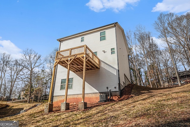 rear view of house featuring a deck