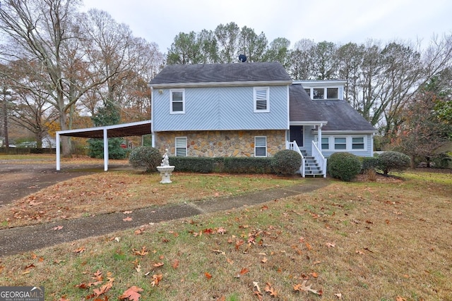 split level home featuring stone siding, a carport, and aphalt driveway