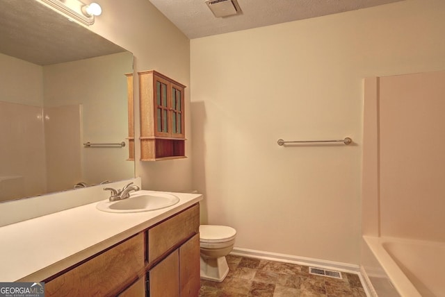 bathroom featuring toilet, baseboards, visible vents, and vanity