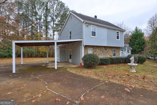 view of front of property with a carport