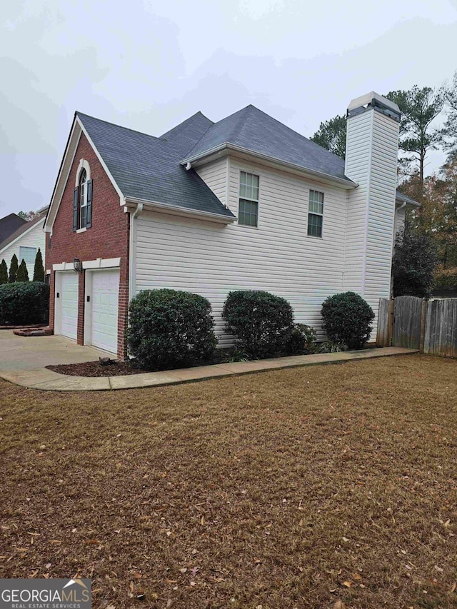 view of side of property with a garage