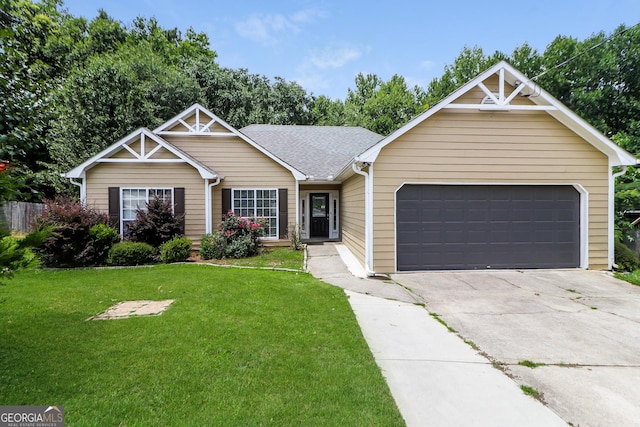 ranch-style house with a garage and a front yard