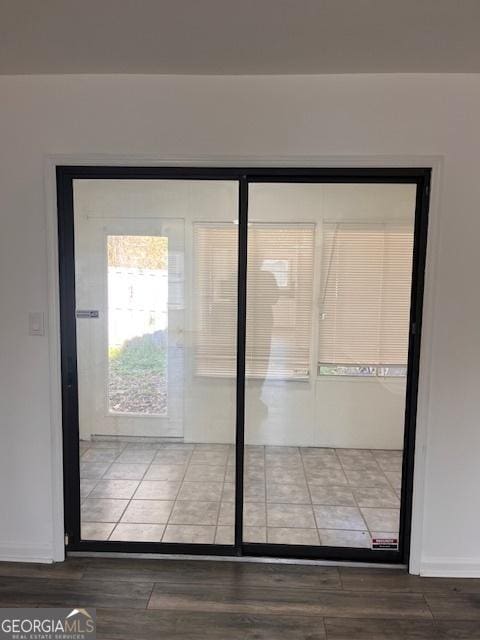2254 Wellington Cir, Lithonia, GA 30058 - doorway to outside with wood finished floors and baseboards
