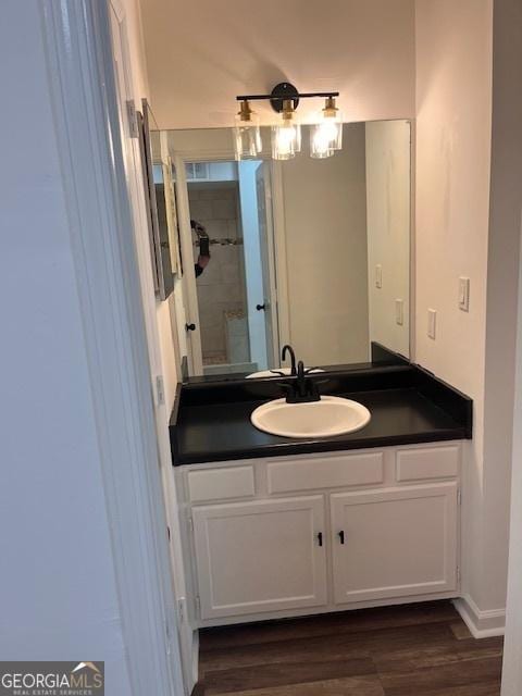 bathroom featuring vanity and hardwood / wood-style floors