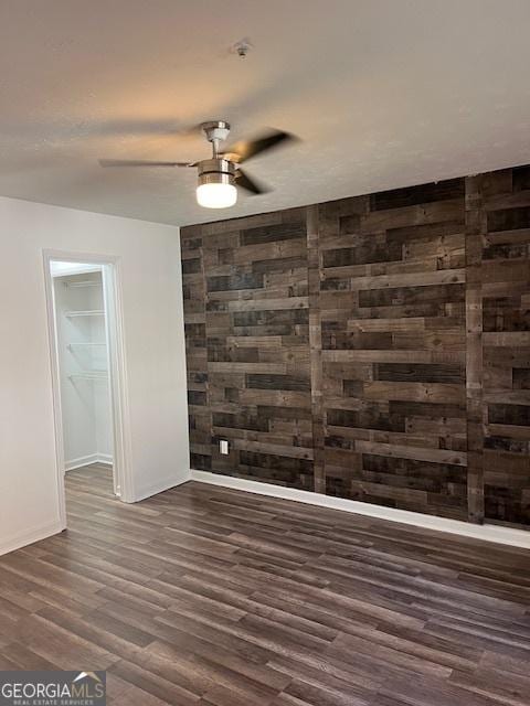 2254 Wellington Cir, Lithonia, GA 30058 - empty room with dark wood-type flooring and ceiling fan