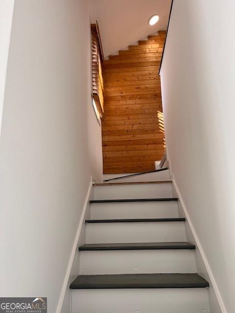 2254 Wellington Cir, Lithonia, GA 30058 - stairs featuring wooden walls
