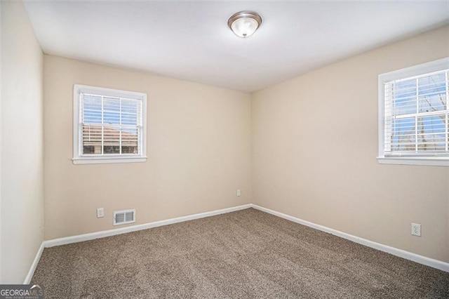 empty room featuring carpet floors