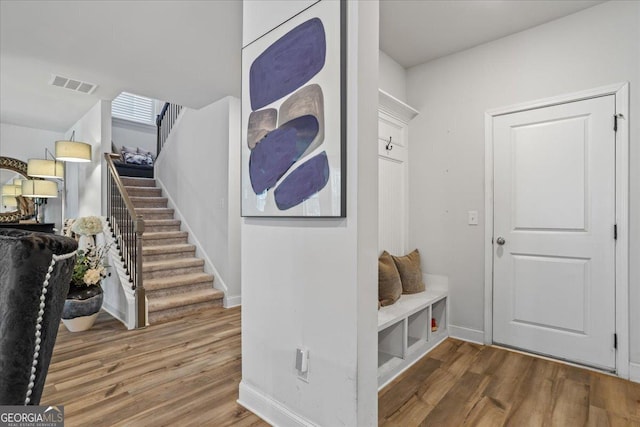 mudroom with hardwood / wood-style floors