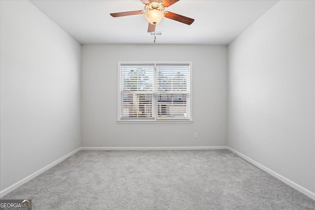 unfurnished room with carpet flooring and ceiling fan