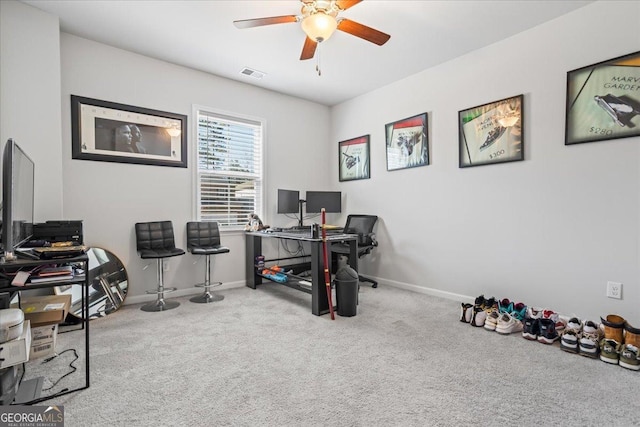 office featuring ceiling fan and light colored carpet