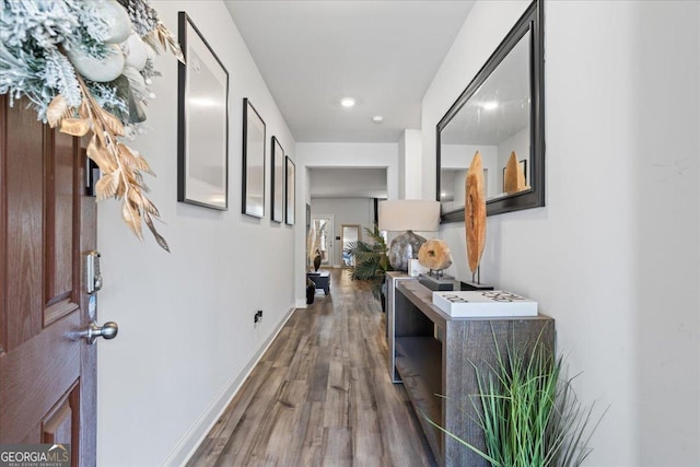 hallway with wood-type flooring