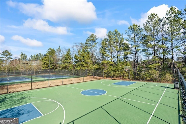 view of sport court featuring tennis court