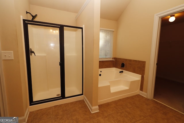 bathroom with tile patterned floors and plus walk in shower