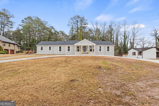 ranch-style house with a front lawn