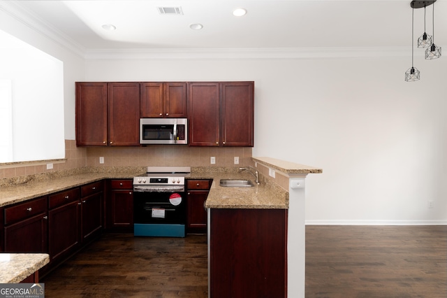 kitchen with dark hardwood / wood-style flooring, range with electric stovetop, hanging light fixtures, and sink