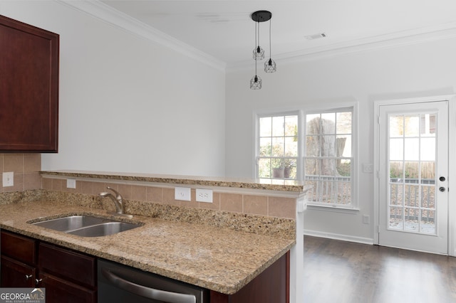 kitchen with dishwasher, backsplash, sink, hanging light fixtures, and dark hardwood / wood-style flooring