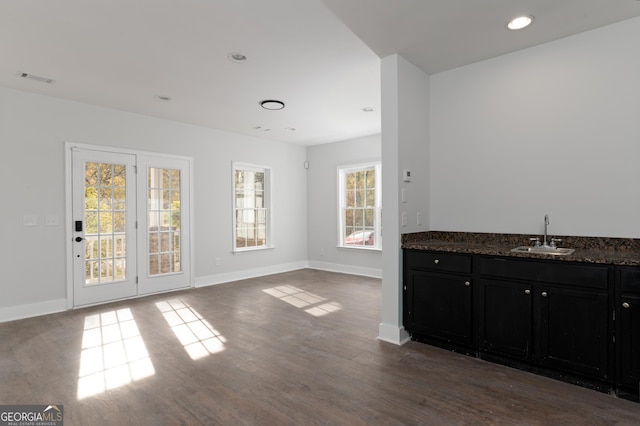 dining room with dark hardwood / wood-style flooring, plenty of natural light, and sink