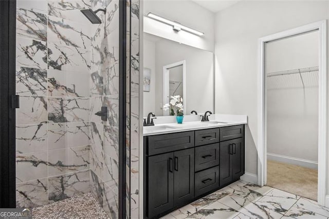 bathroom featuring vanity and tiled shower