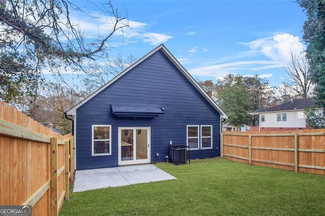 back of property featuring central AC, a patio, and a lawn