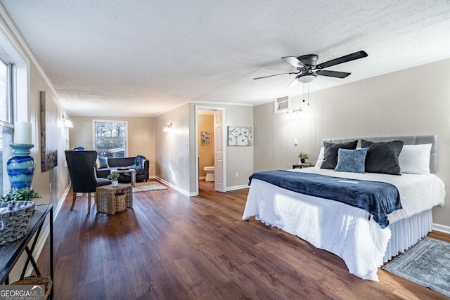 bedroom with crown molding, dark hardwood / wood-style floors, ceiling fan, and a textured ceiling