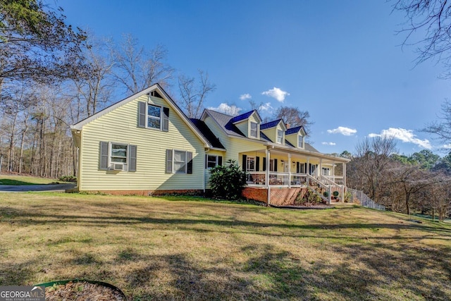 back of property featuring a lawn and covered porch