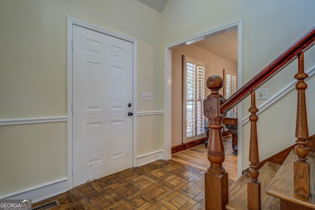 entryway with parquet floors