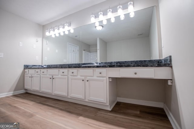 bathroom featuring wood-type flooring and vanity