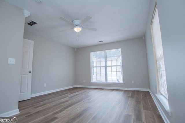 empty room featuring ceiling fan and wood-type flooring