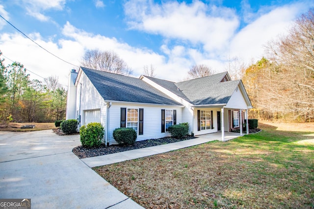 view of front of home with a porch and a front yard