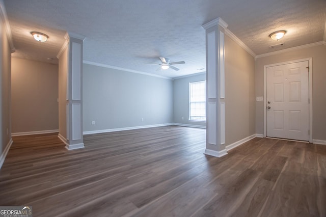 interior space with a textured ceiling, dark hardwood / wood-style floors, ceiling fan, and crown molding