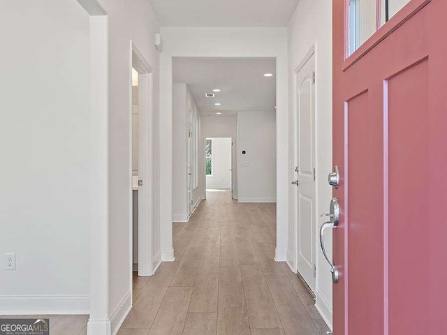 hallway with light wood-type flooring