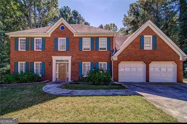 colonial house with a garage and a front lawn