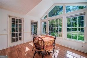 sunroom featuring vaulted ceiling