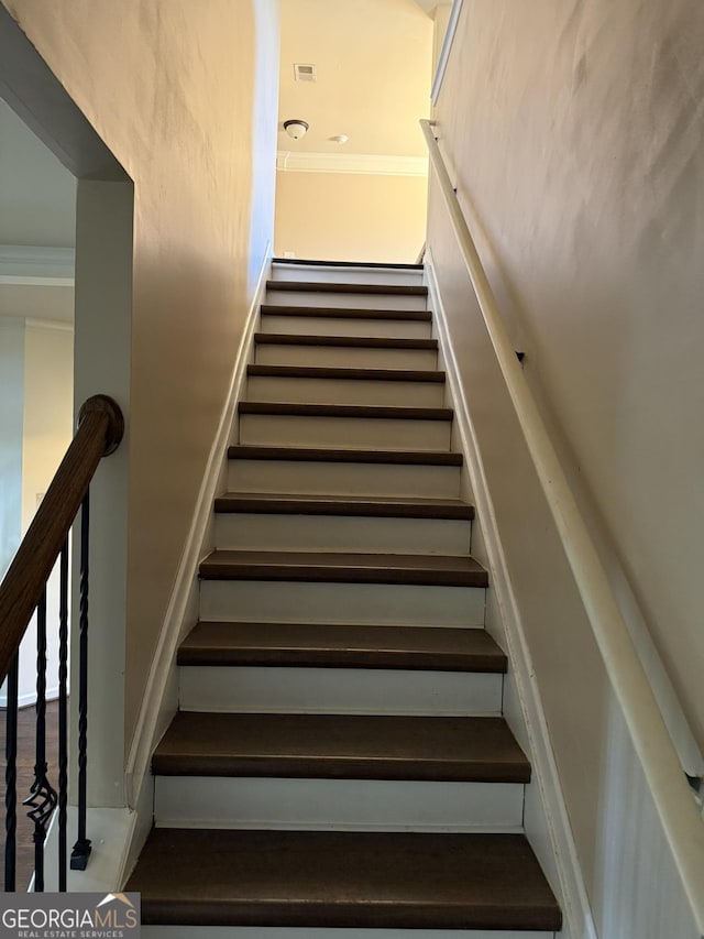 stairs with crown molding