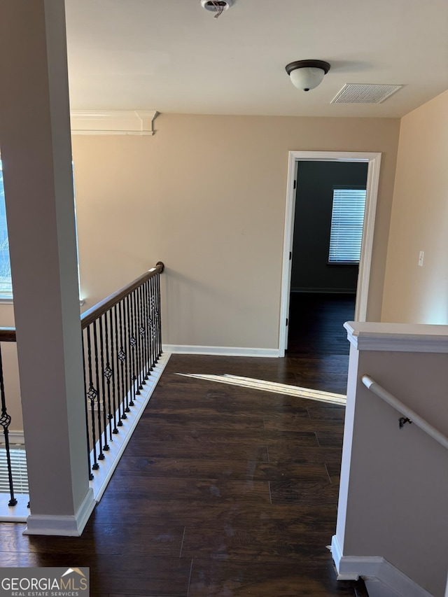 stairs with hardwood / wood-style floors