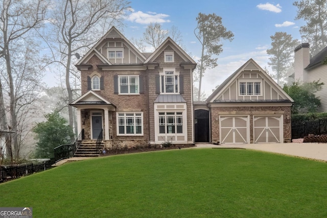 view of front of property featuring a garage and a front lawn