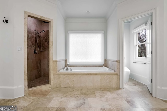 bathroom featuring crown molding, toilet, and separate shower and tub