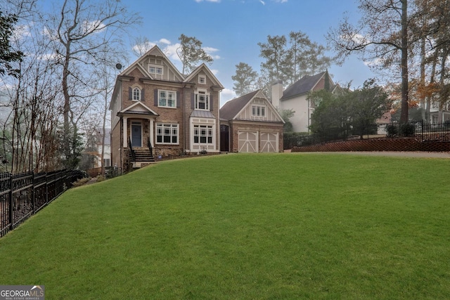 view of front facade with an outbuilding and a front lawn