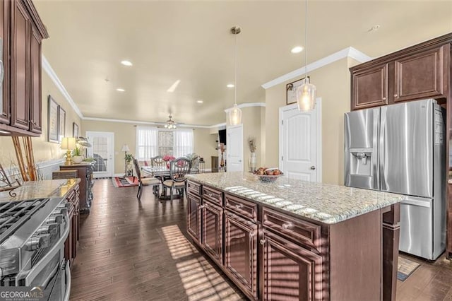 kitchen with stainless steel appliances, dark hardwood / wood-style floors, ornamental molding, and ceiling fan