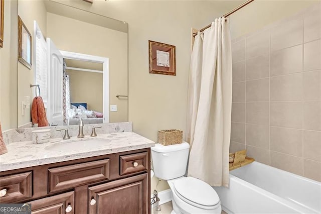 full bathroom with shower / bath combination with curtain, toilet, and vanity